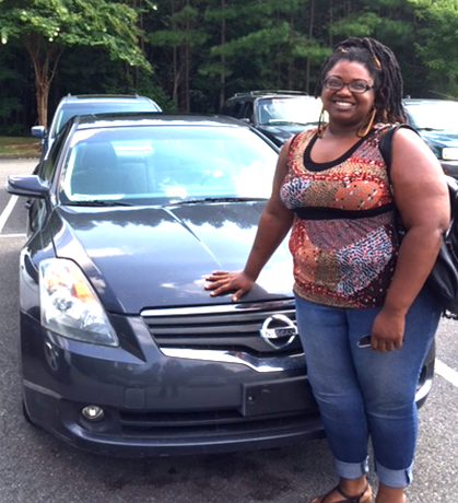 Picture of Shekia Stukes next to her car