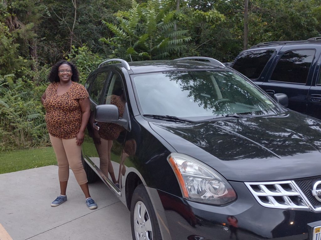 Picture of Barbara Green next to her car